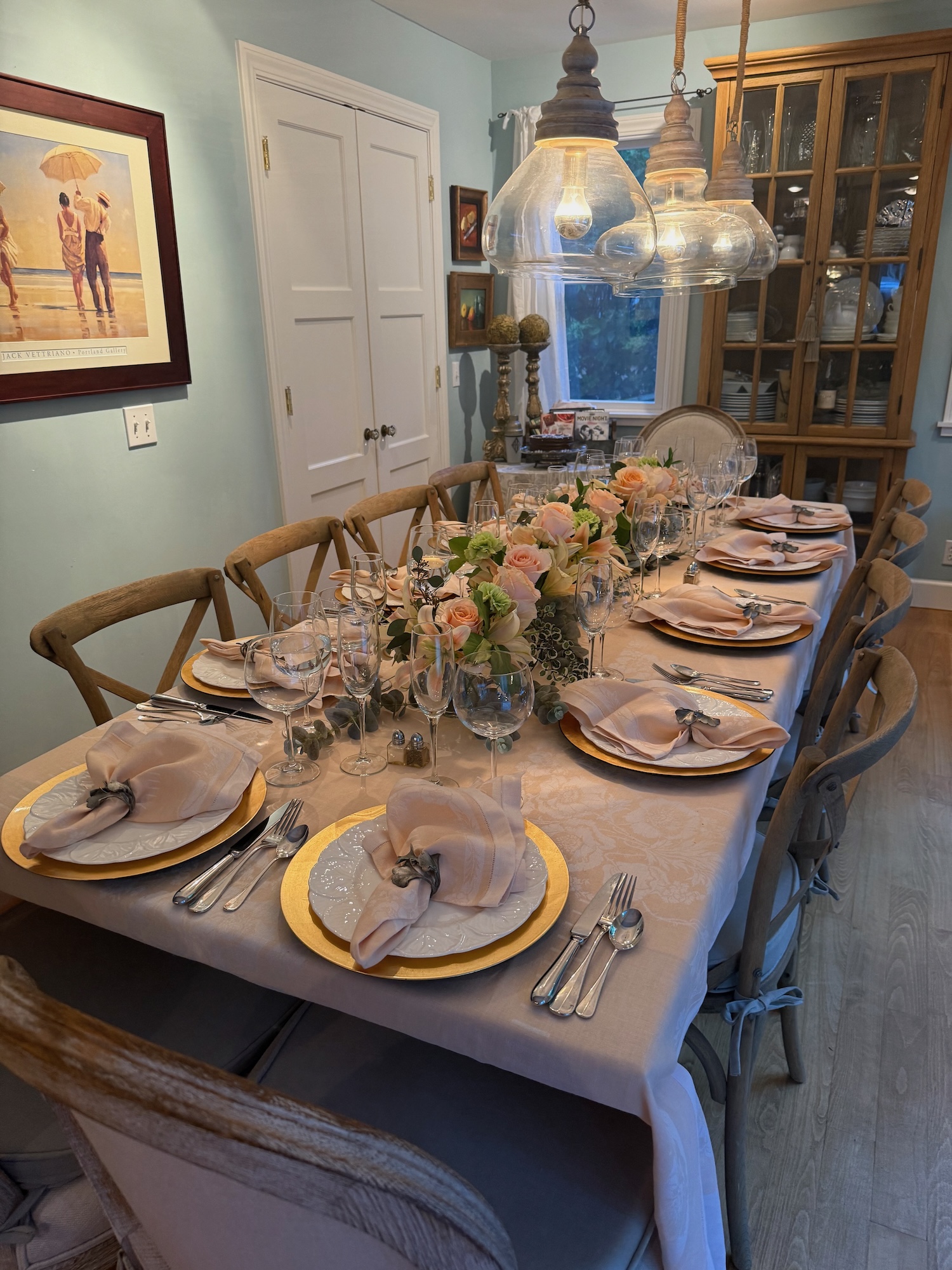 Full dining room view with peach and ivory tablescape