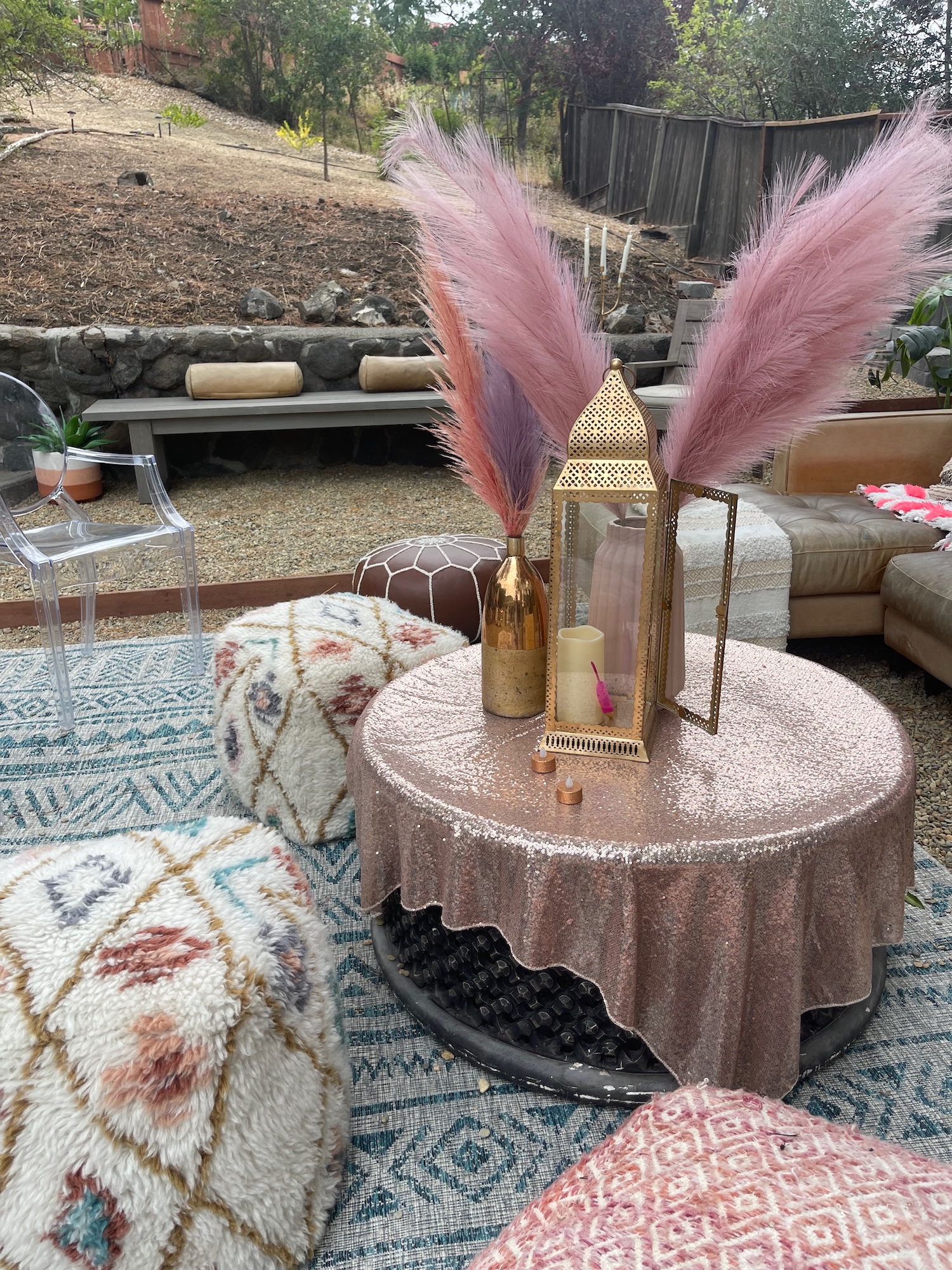 Sequin cocktail table with pampas stems and lantern styling